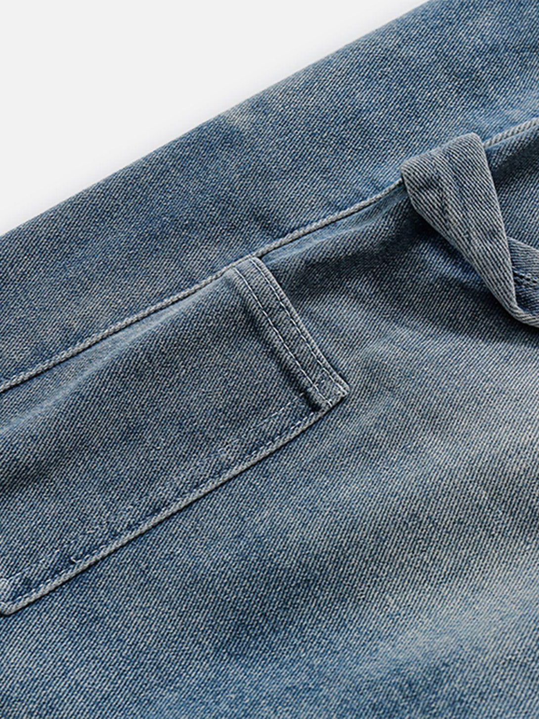 Detailed fabric and stitching of TALISHKO's washed denim jorts, showcasing the drawstring waist.