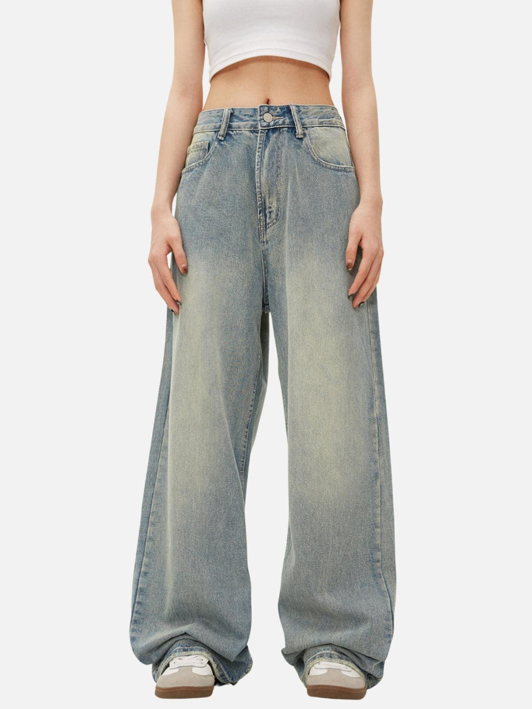 TALISHKO loose jeans, worn by a model, showcasing a relaxed fit and casual style.