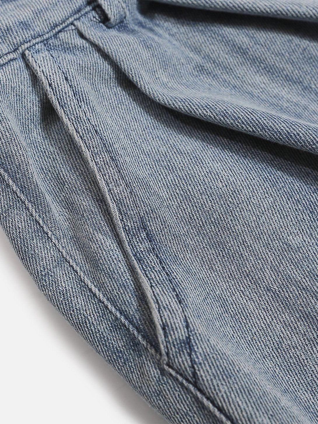 A close-up of TALISHKO jorts, highlighting the detailed stitching and classic denim texture.