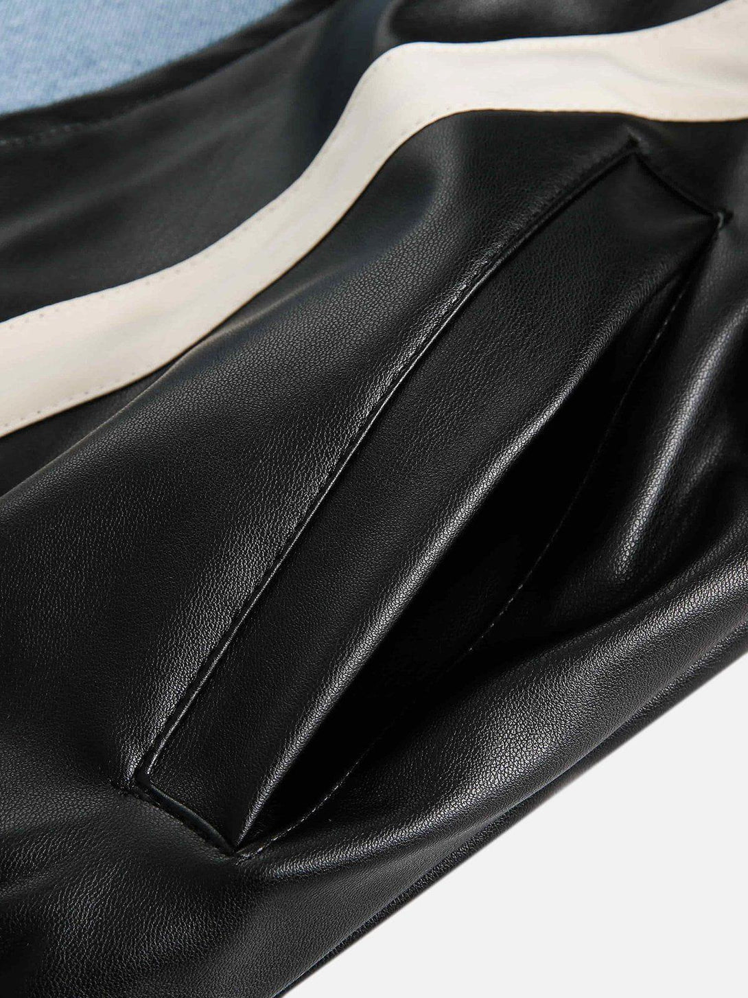 A detailed view of TALISHKO's faux leather pocket design, highlighting sleek craftsmanship.