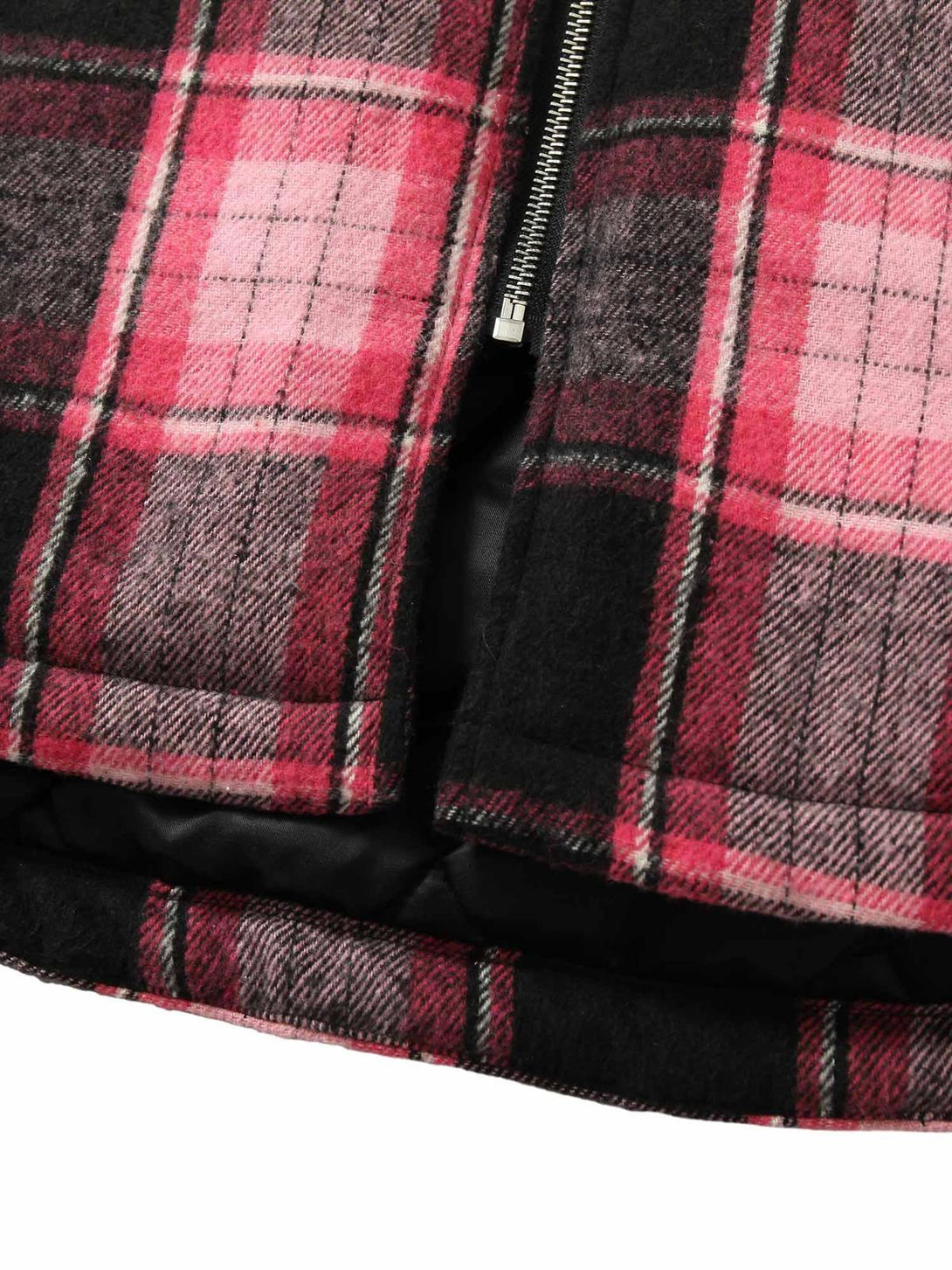 Detailed plaid pattern and zipper on a padded jacket, showcasing TALISHKO's craftsmanship.