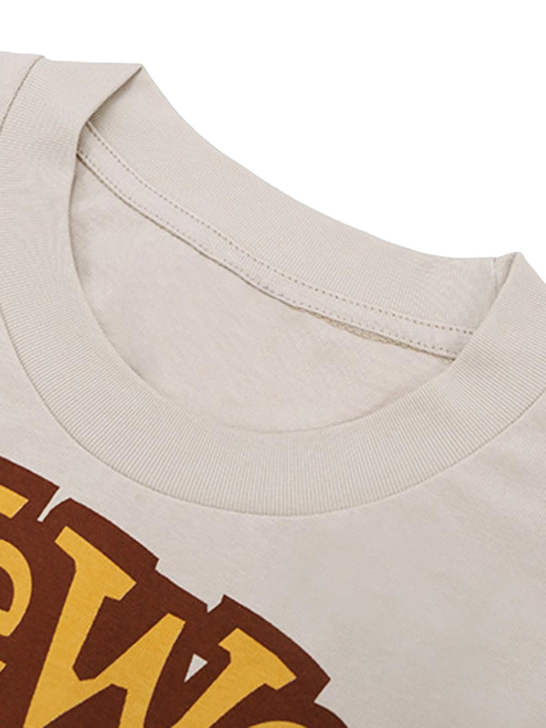 A close-up of the TALISHKO T-shirt's neckline, featuring bold bear and letter print design.
