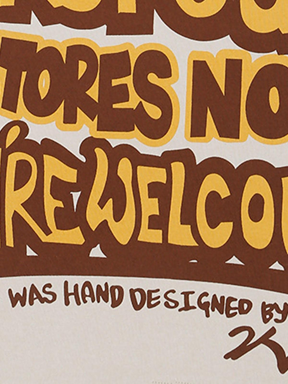 Hand-designed lettering detail on TALISHKO hip hop T-shirt, showcasing graphic print style.