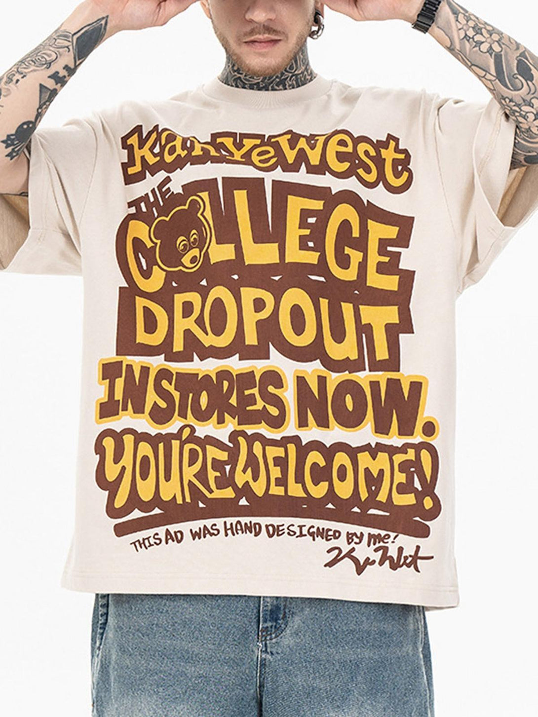 Model wearing TALISHKO hip hop T-shirt with bold bear and letter print in beige tones.