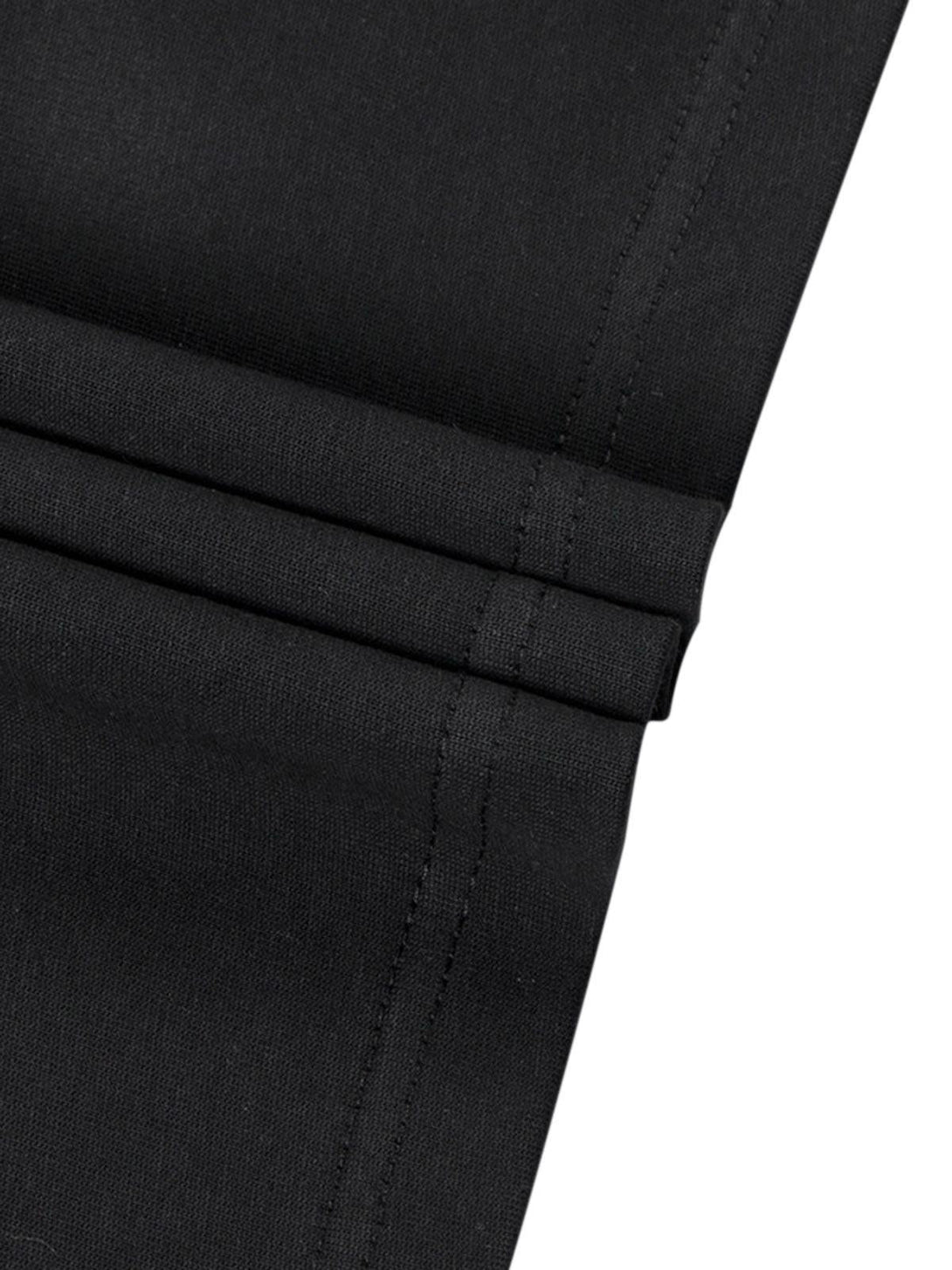 Detailed fabric and stitching of TALISHKO T-shirt sleeve in sleek black material.