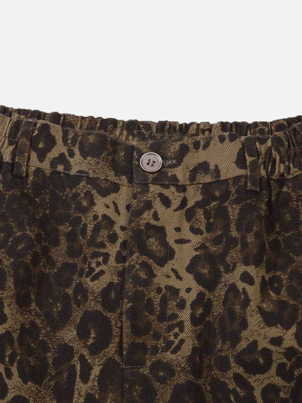 A close-up of TALISHKO leopard print shorts, showcasing the detailed pattern and button detail.