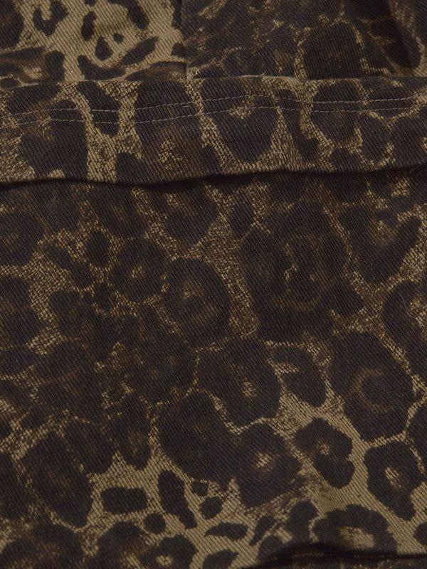 A detailed view of the leopard print fabric on TALISHKO shorts, highlighting its rich texture.