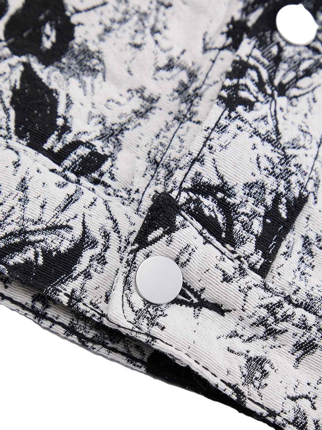 Detailed fabric and stitching on TALISHKO's black and white floral denim jacket.