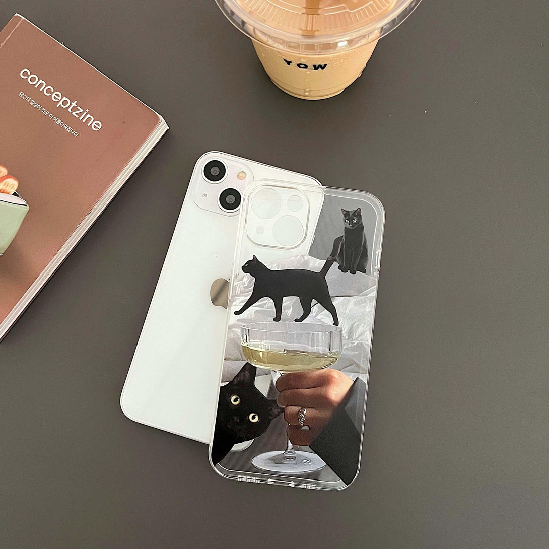 TALISHKO iPhone case with whimsical black cats and a champagne glass design, perfect for cat lovers.