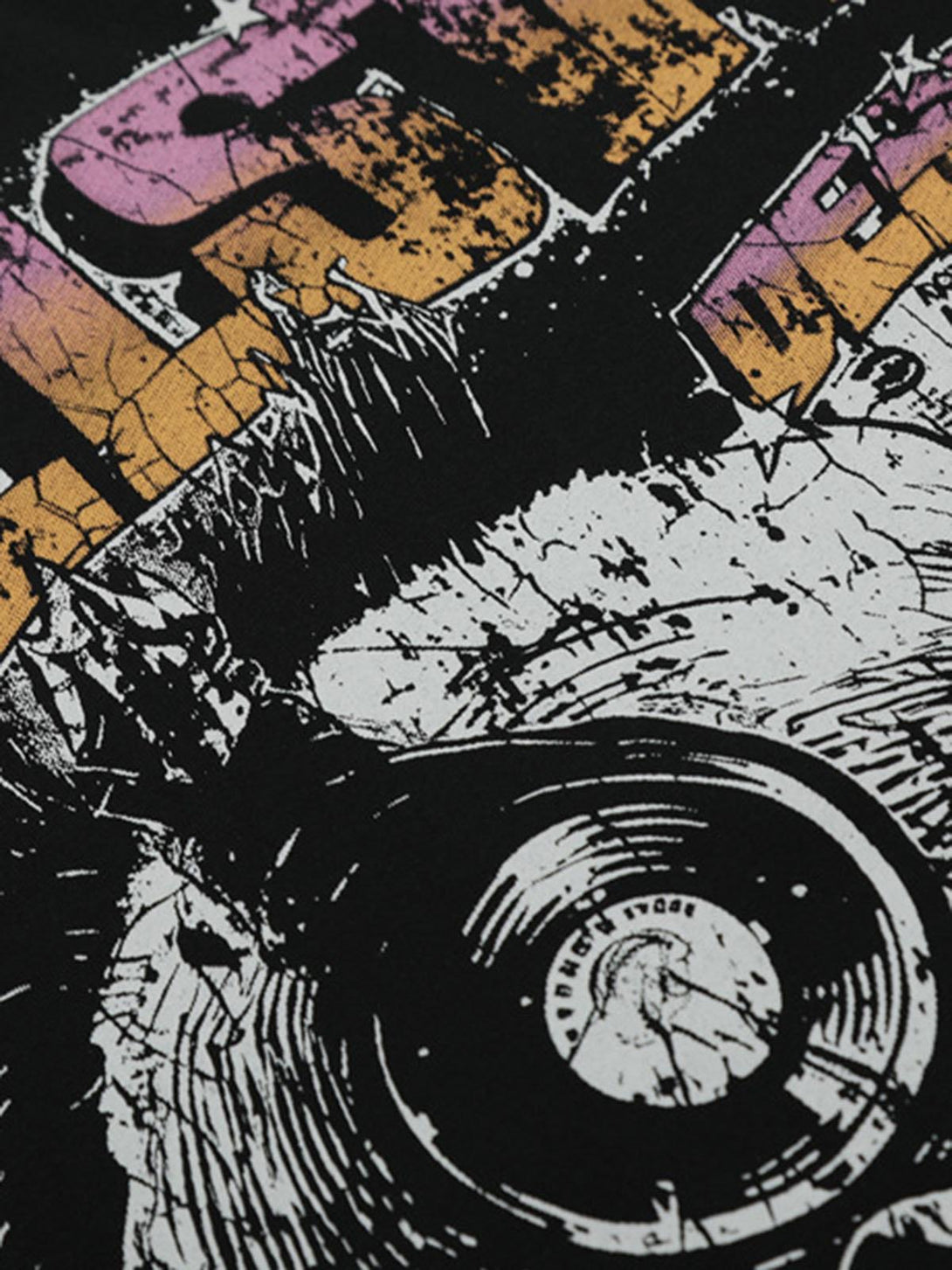 A detailed view of a black graphic T-shirt by TALISHKO, highlighting its bold and edgy design.