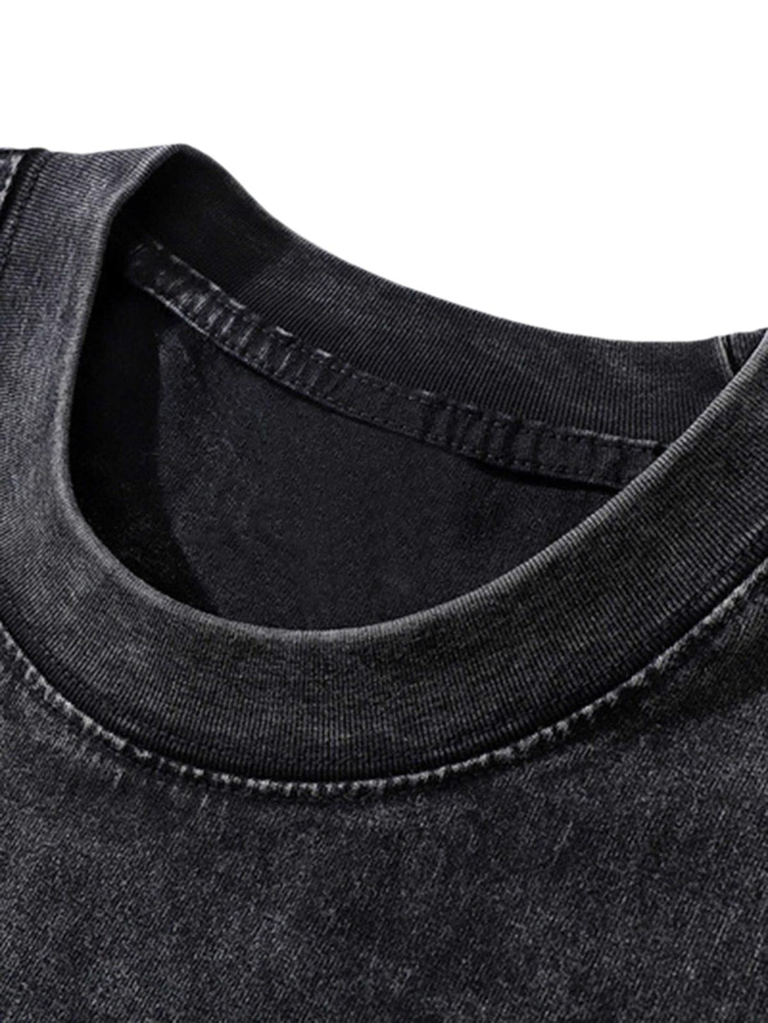 A close-up view of the TALISHKO black T-shirt's neckline, highlighting its comfortable fit.