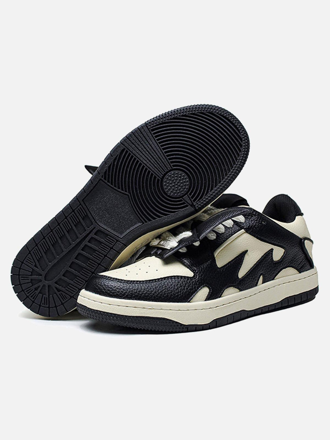 Black and white skate shoes by TALISHKO with dynamic contrast, ideal for a trendy street look.