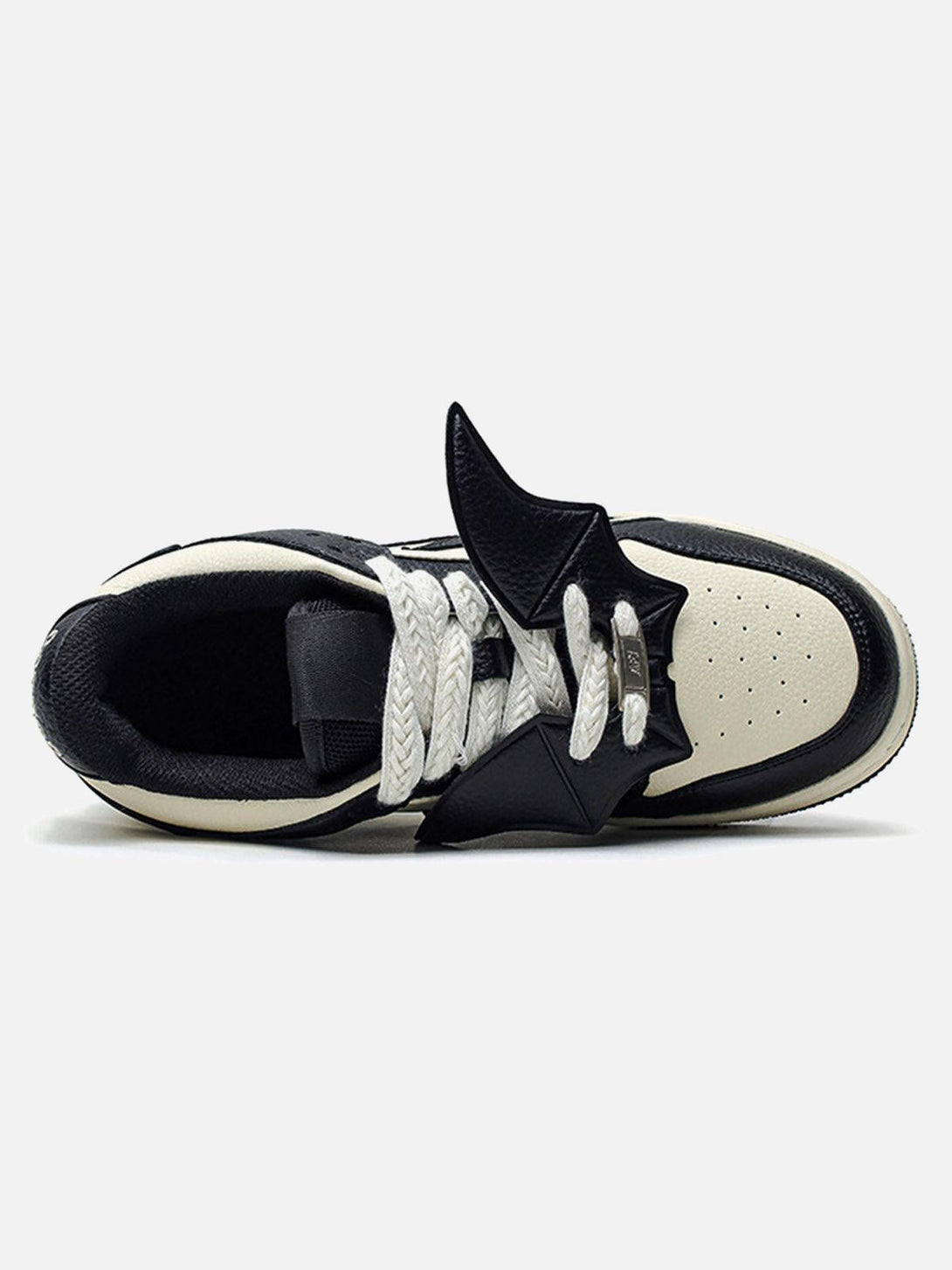 Top view of TALISHKO black and white skate shoes highlighting unique contrast and design.