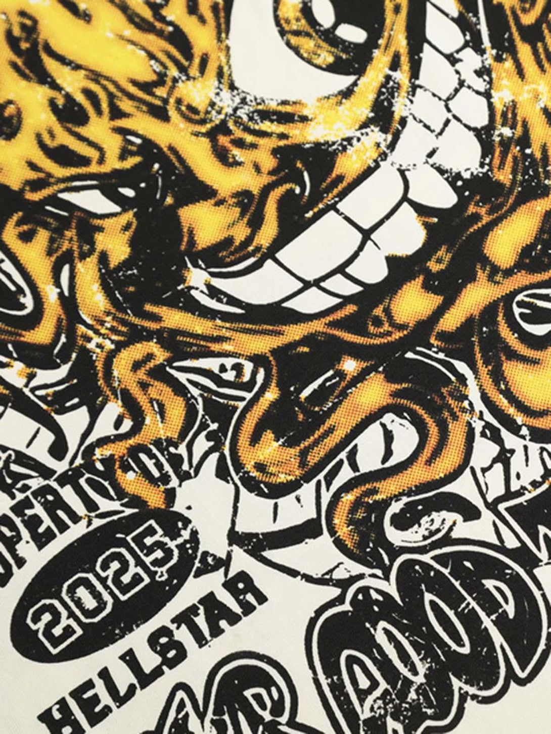 Zoomed-in detail of bold artwork on TALISHKO graphic T-shirt, highlighting vibrant design.