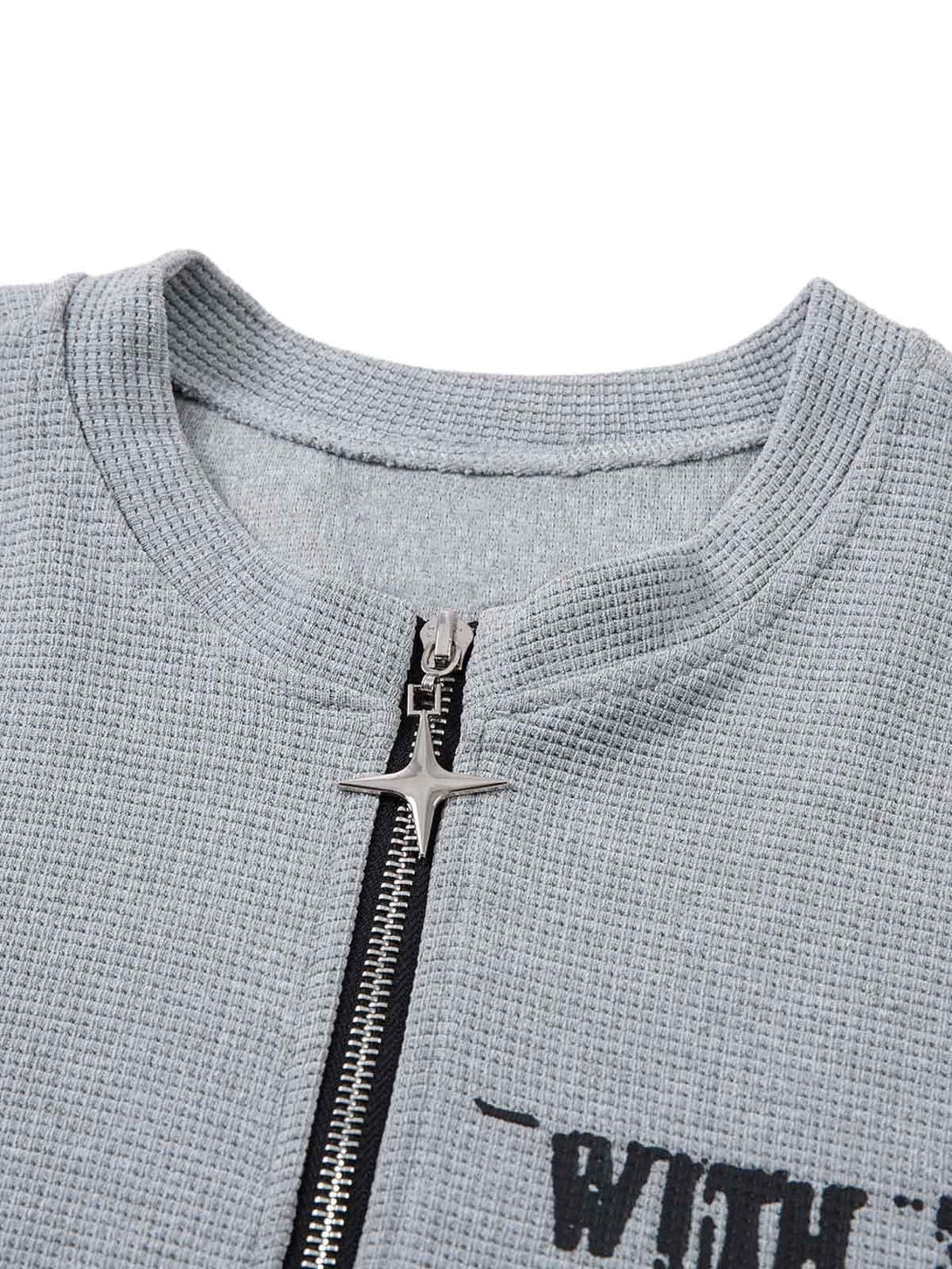 Intricate look at the TALISHKO gray T-shirt with unique zipper and textured fabric details.