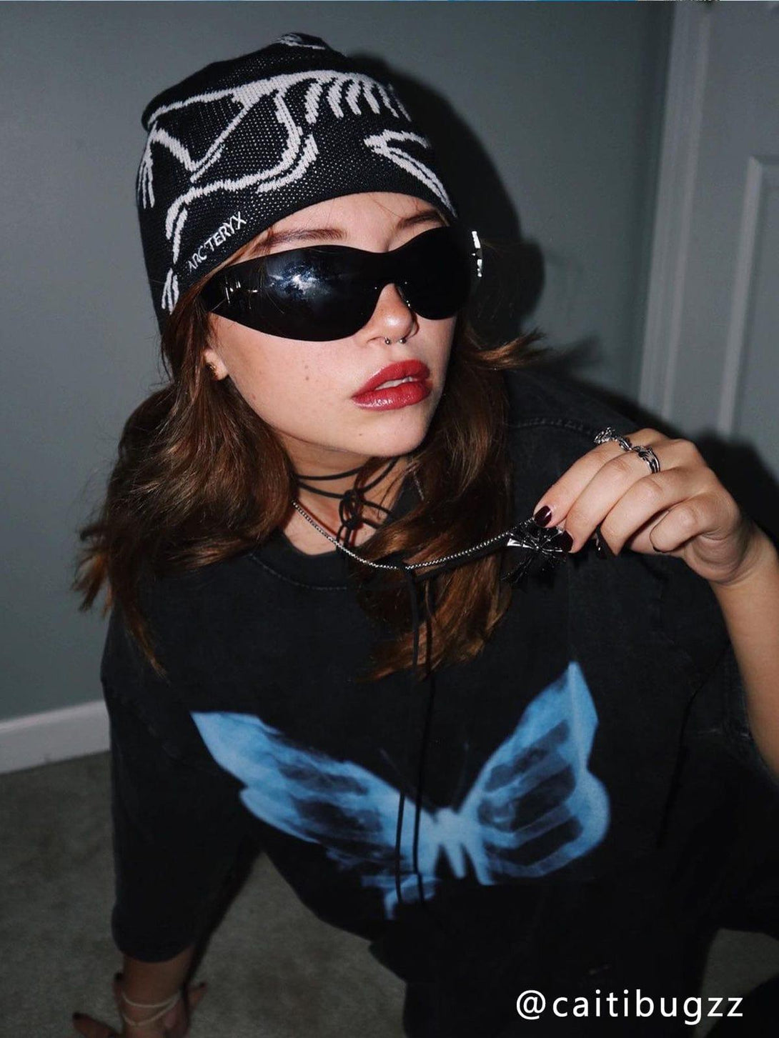 Edgy look with TALISHKO graphic tee, showcasing a striking bone butterfly design and black beanie.