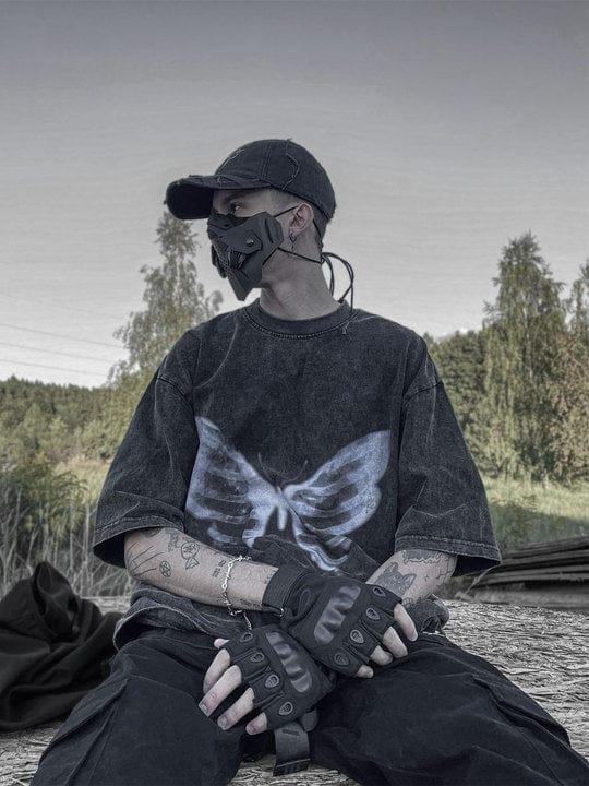 Urban style captured with a TALISHKO graphic tee, featuring a bold bone butterfly design.