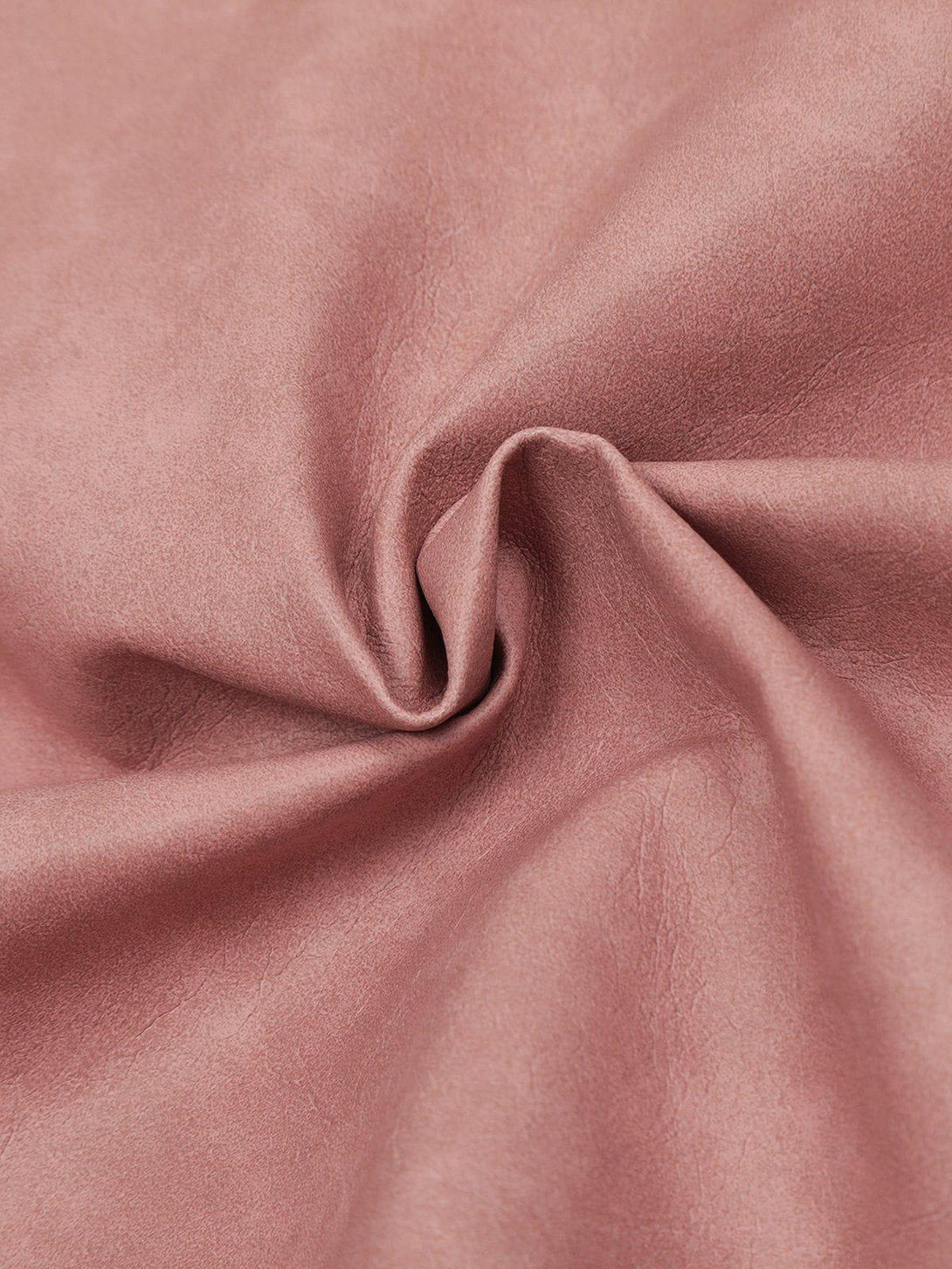 Zoomed-in texture of pink faux leather by TALISHKO, showcasing elegant material detail.