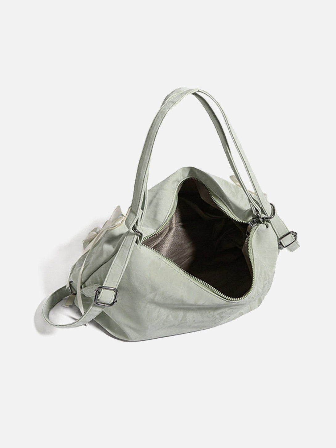 A detailed look inside the TALISHKO tote bag, showcasing its spacious interior and soft green color.