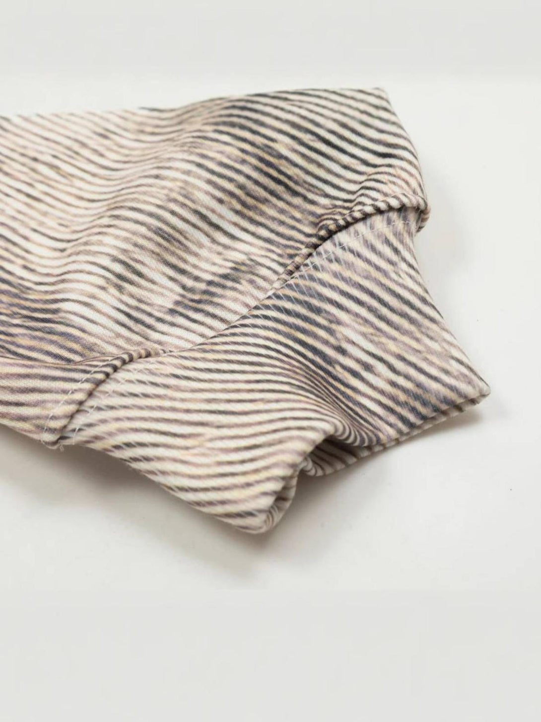 Intricate look at the branch pattern and texture of TALISHKO's stylish hoodie sleeve.