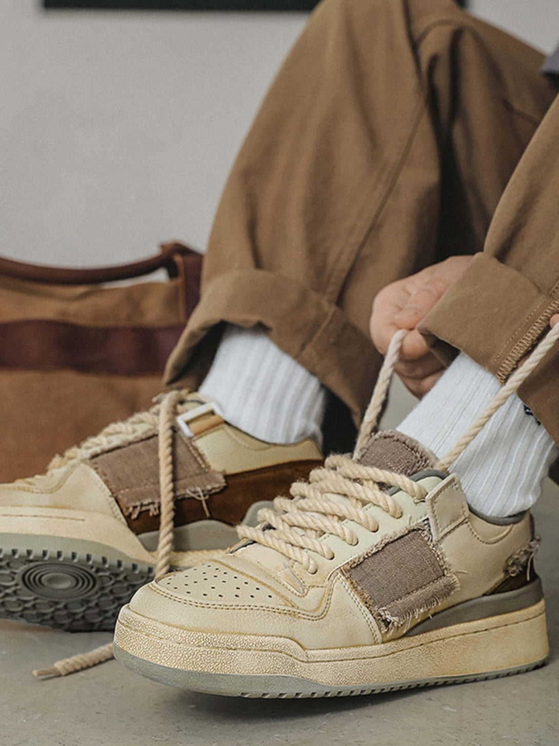 TALISHKO casual shoes styled with rolled-up pants, highlighting unique rope laces and design.