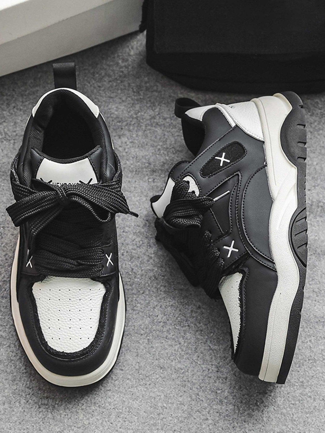 TALISHKO black and white board shoes with thick soles, showcasing a stylish and versatile design.