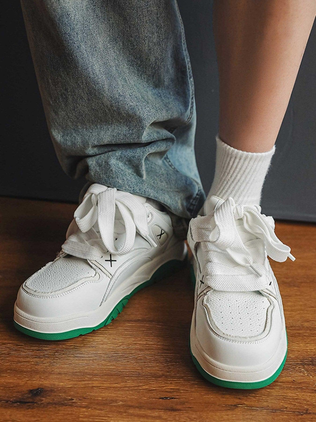 TALISHKO versatile board shoes with green soles paired with casual jeans for a trendy look.