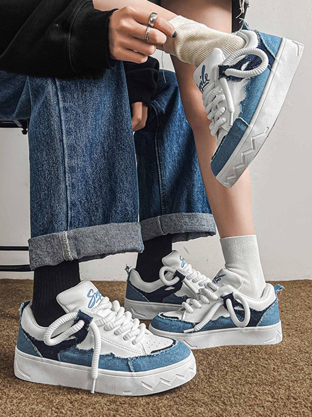Casual denim-inspired canvas shoes by TALISHKO, styled with white laces and a sporty look.