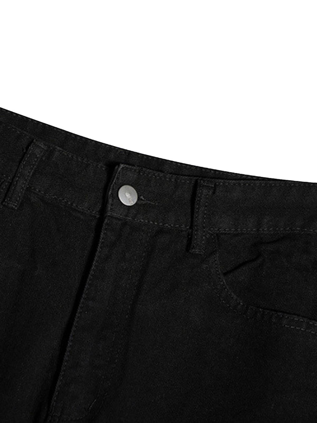Detailed view of TALISHKO jeans' button and waistband, showcasing minimalist design elements.