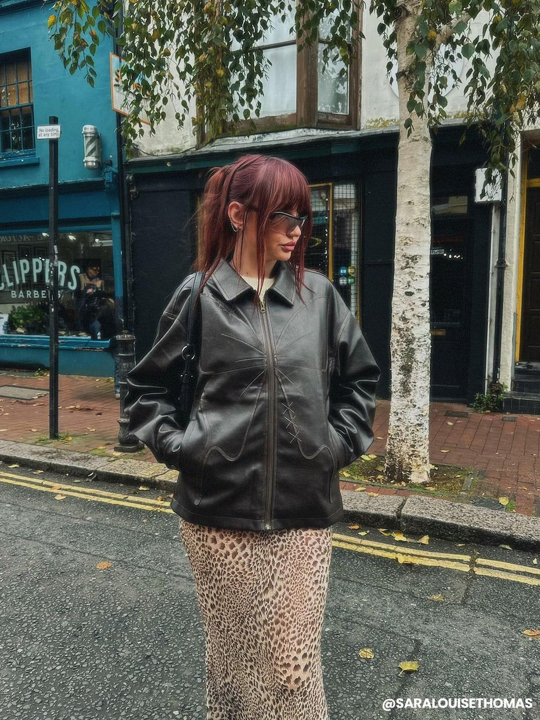 Stylish street look featuring a TALISHKO butterfly faux leather jacket with a leopard print skirt.