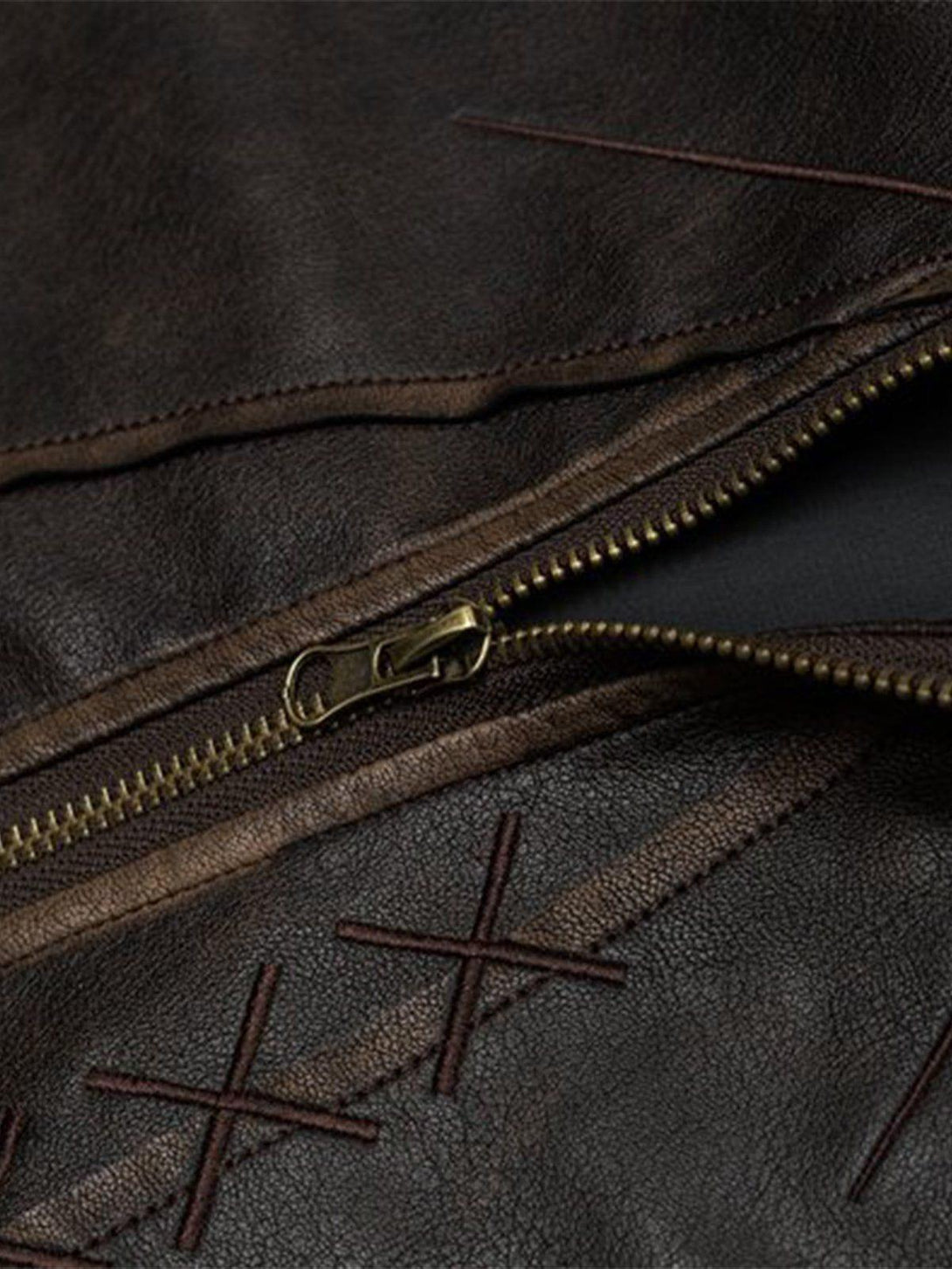 Detailed view of TALISHKO's butterfly faux leather jacket, highlighting zipper and stitching.