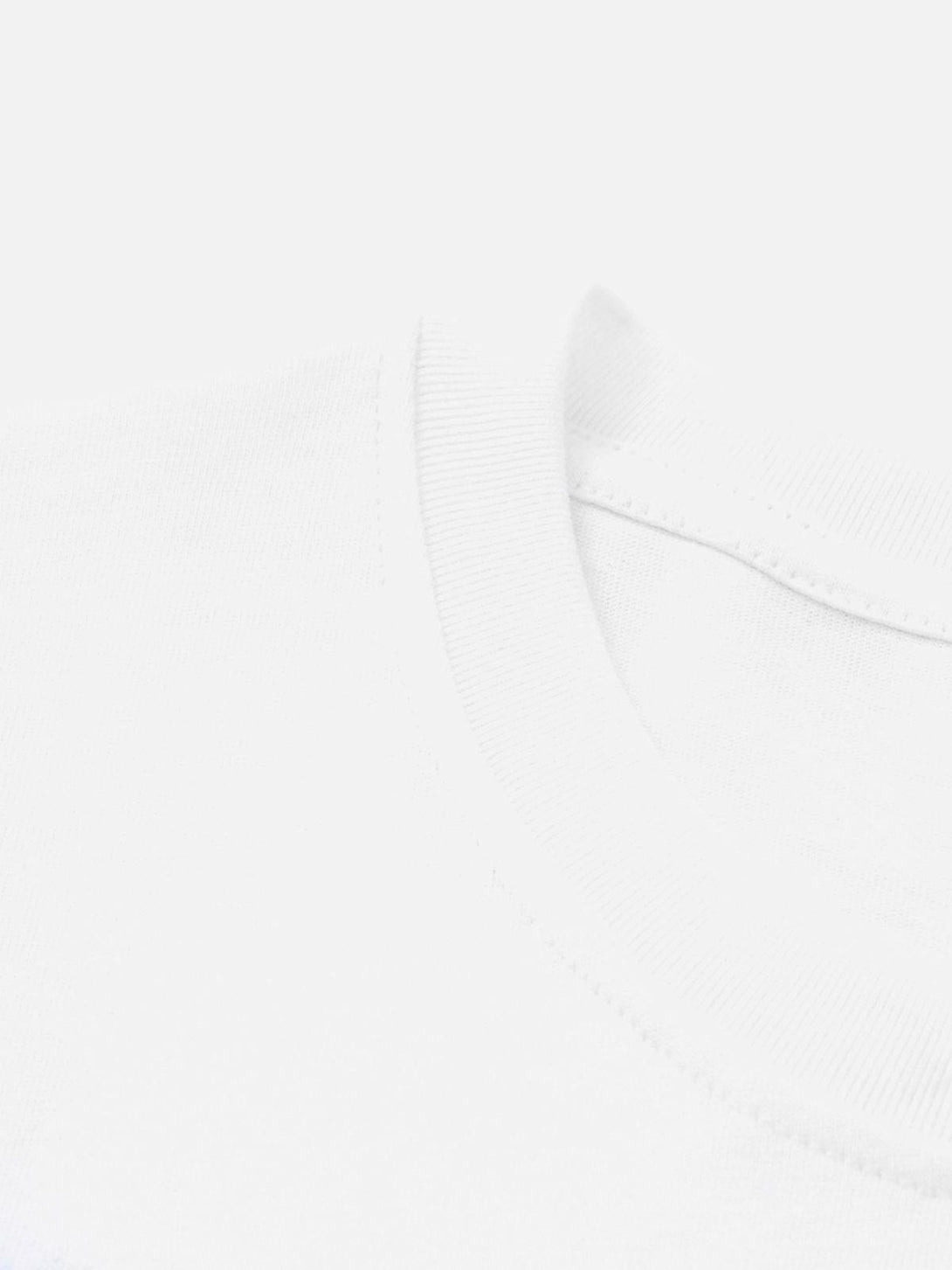 A detailed view of the neckline on a white graphic T-shirt by TALISHKO, highlighting its quality stitching.