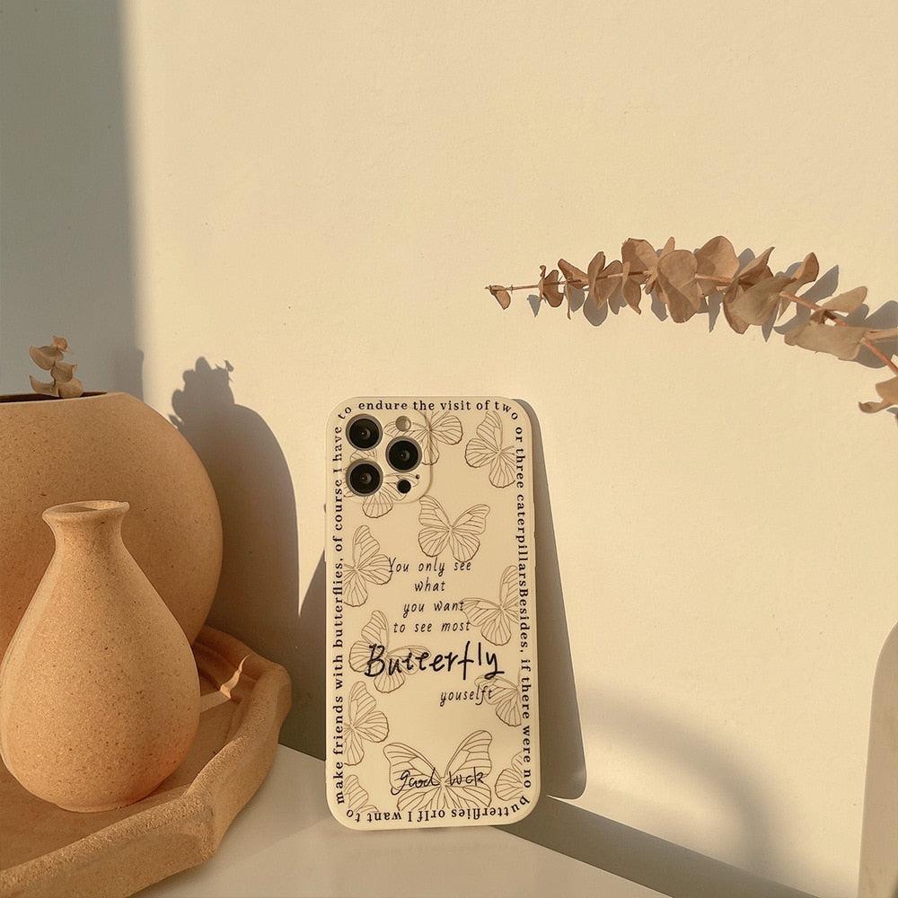 Butterfly-themed iPhone case by TALISHKO, featuring inspirational text and delicate design details.