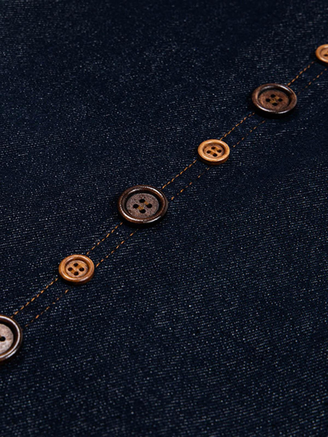 Intricate look at button details on TALISHKO barrel jeans, showcasing craftsmanship and style.