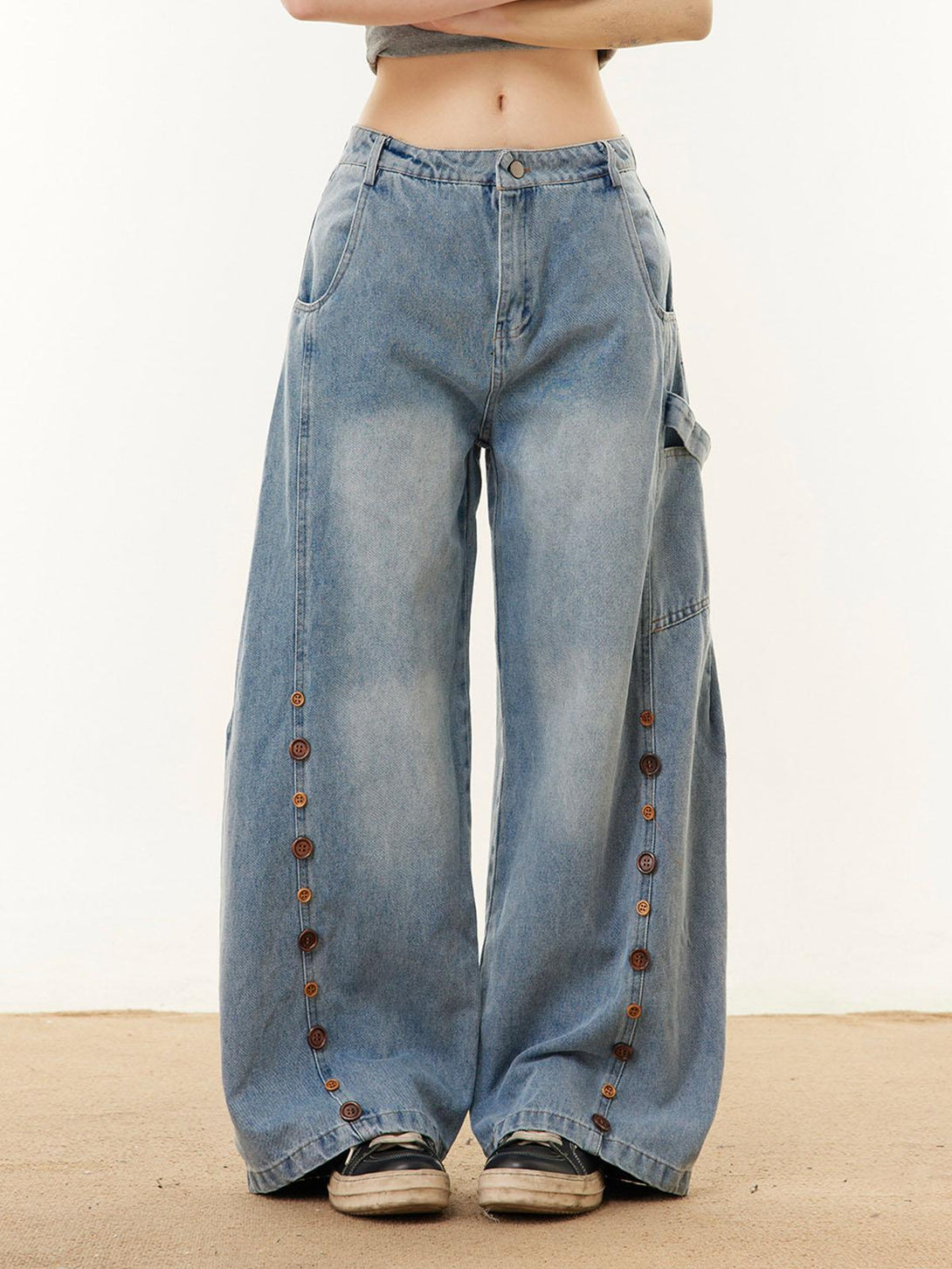 Stylish barrel jeans by TALISHKO, front view, showcasing button embroidery for a chic vibe.