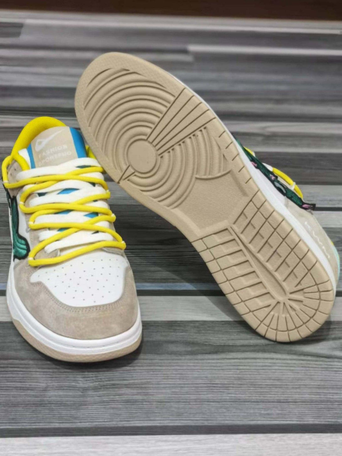 TALISHKO board shoes feature a cactus design and yellow laces, showcasing the sole texture.