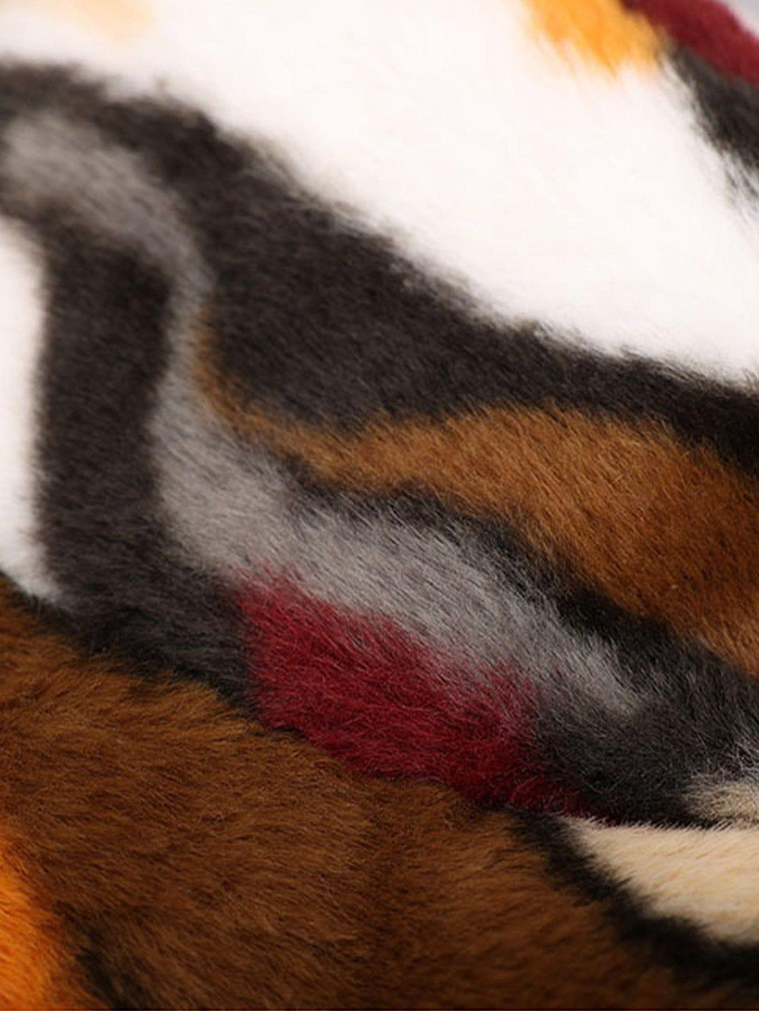 A vibrant close-up of TALISHKO's plush bucket hat, highlighting its camo stripe texture.