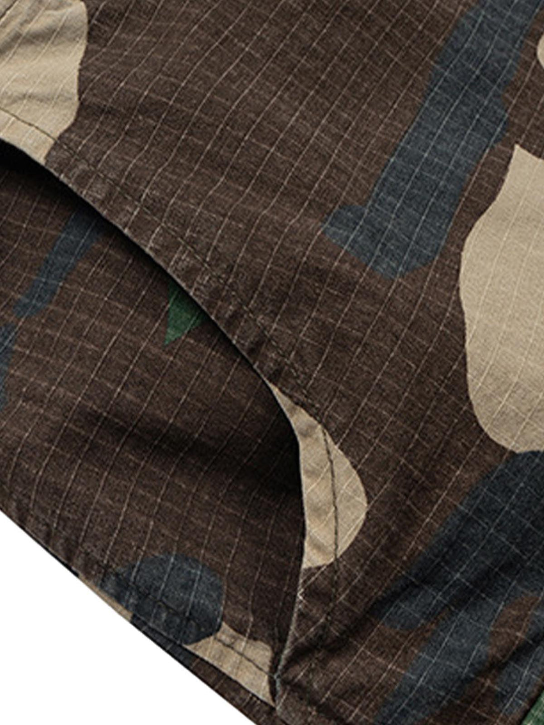 Textured pattern and stitch detail of TALISHKO camouflage cropped cargo shorts fabric.