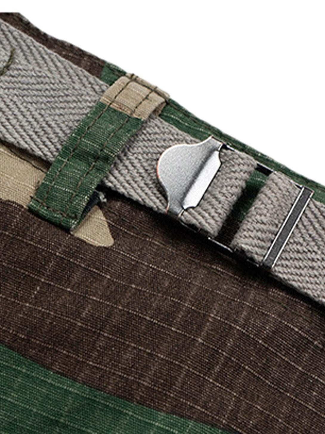 Focusing on the buckle waist detail of TALISHKO camouflage cropped cargo shorts.