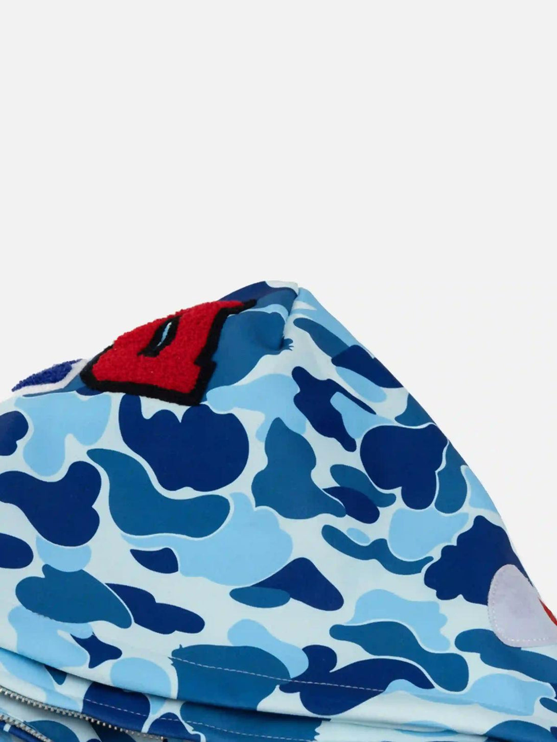 A close-up of the blue camouflage pattern and bold lettering on TALISHKO's unique hoodie design.