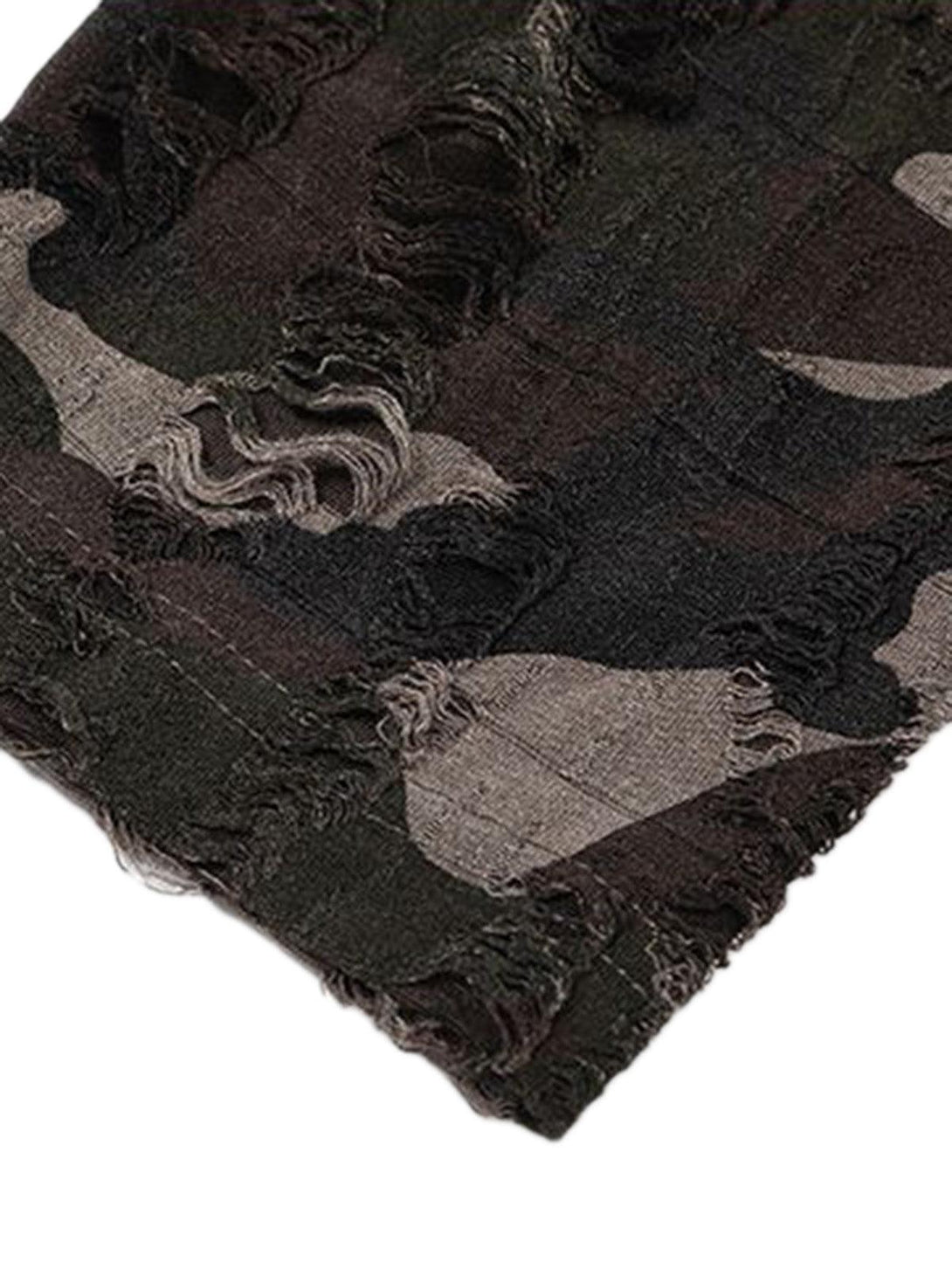 Ripped camouflage texture on TALISHKO's jersey T-shirt, highlighting rugged detail.