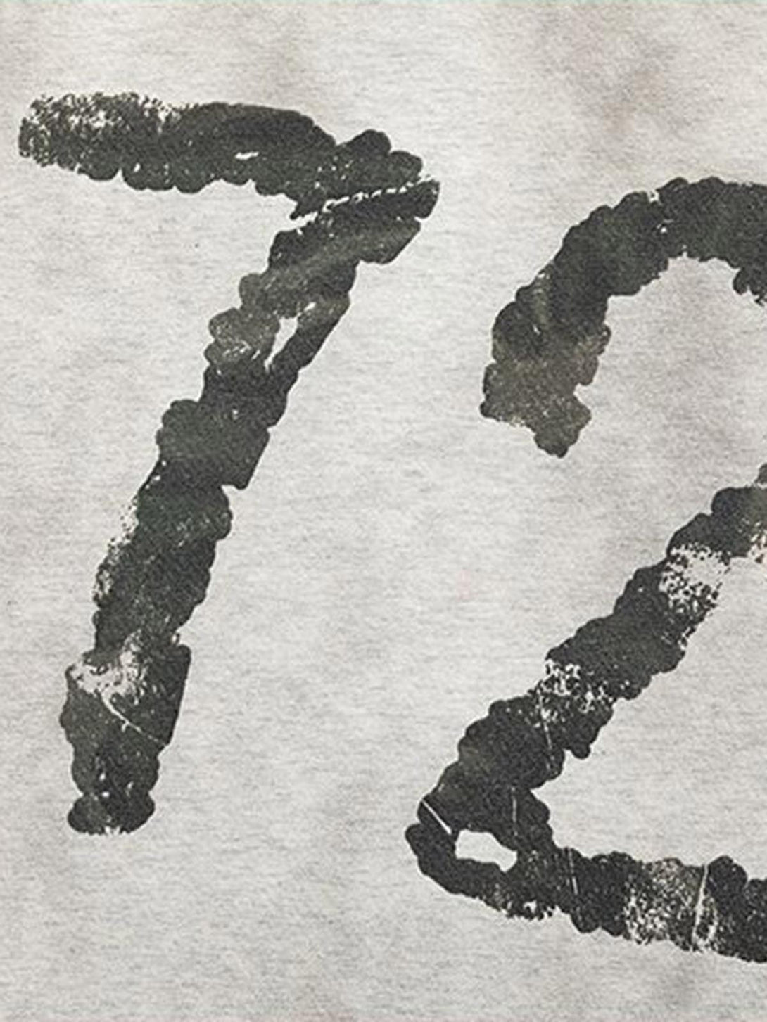 TALISHKO's long sleeve T-shirt showcases a distressed "72" graphic, adding a rugged touch.