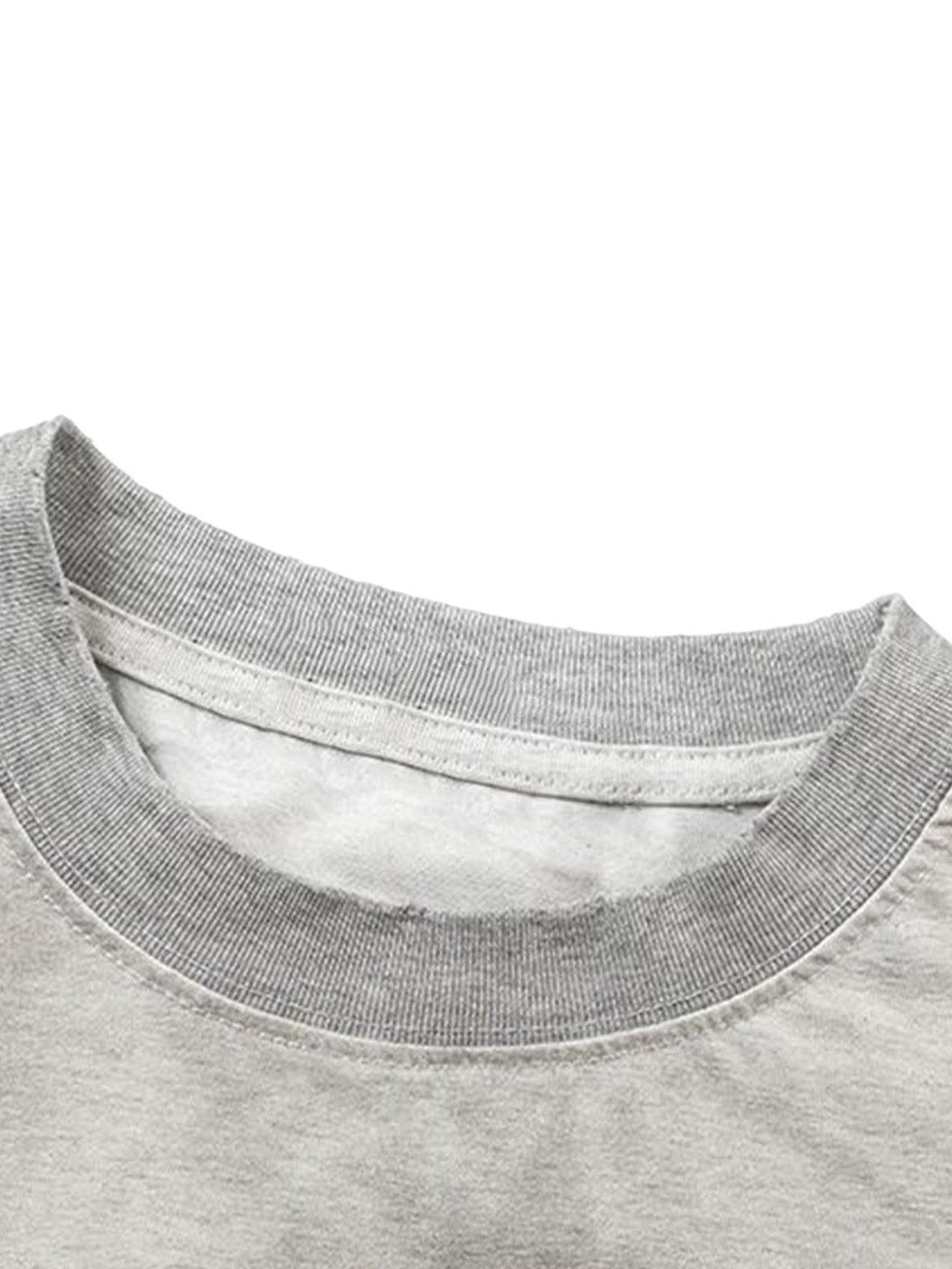 Intricate look at TALISHKO's gray jersey neckline, showcasing refined stitching detail.