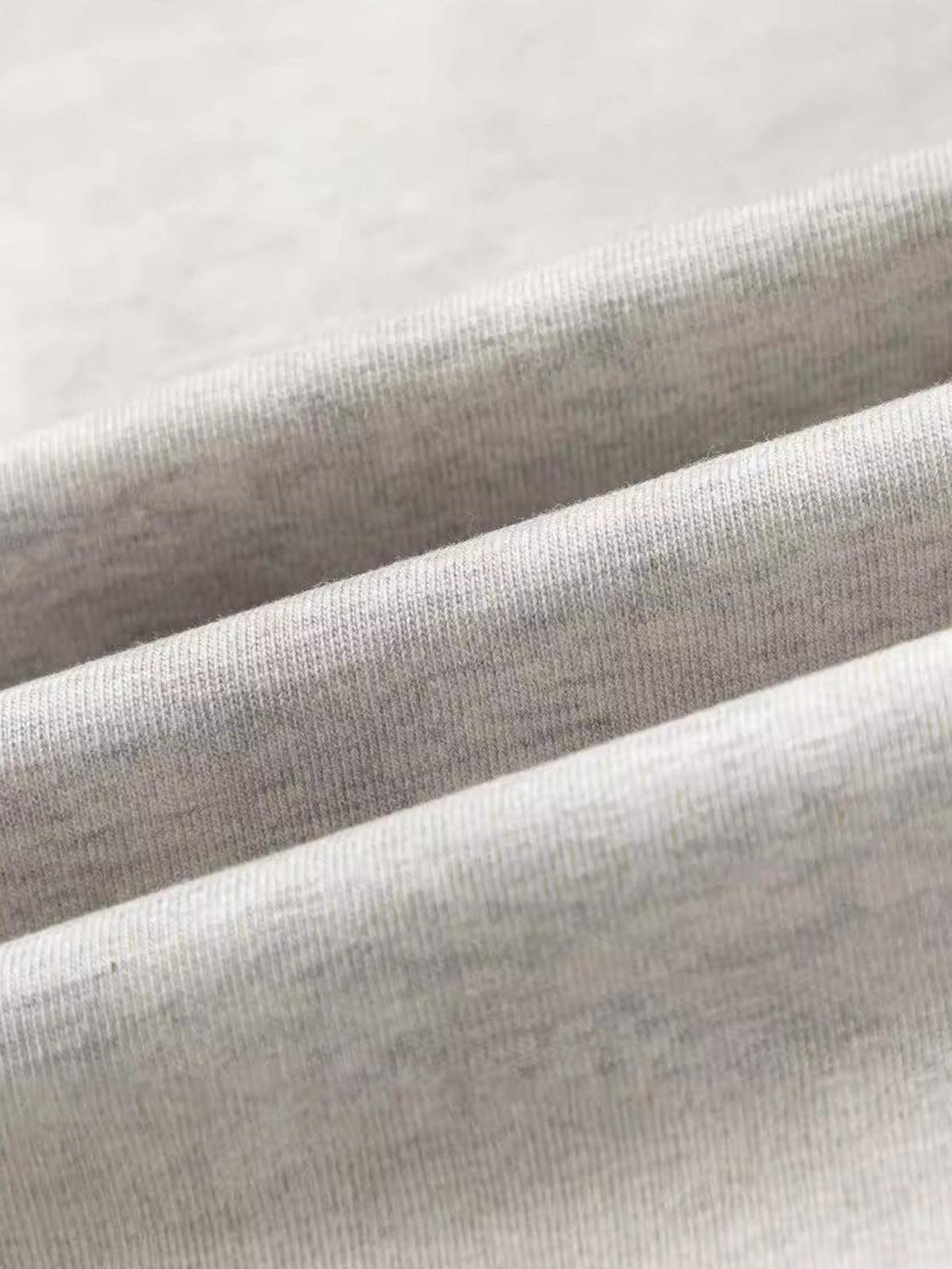 Zoomed-in texture of TALISHKO's jersey fabric, highlighting quality and craftsmanship.