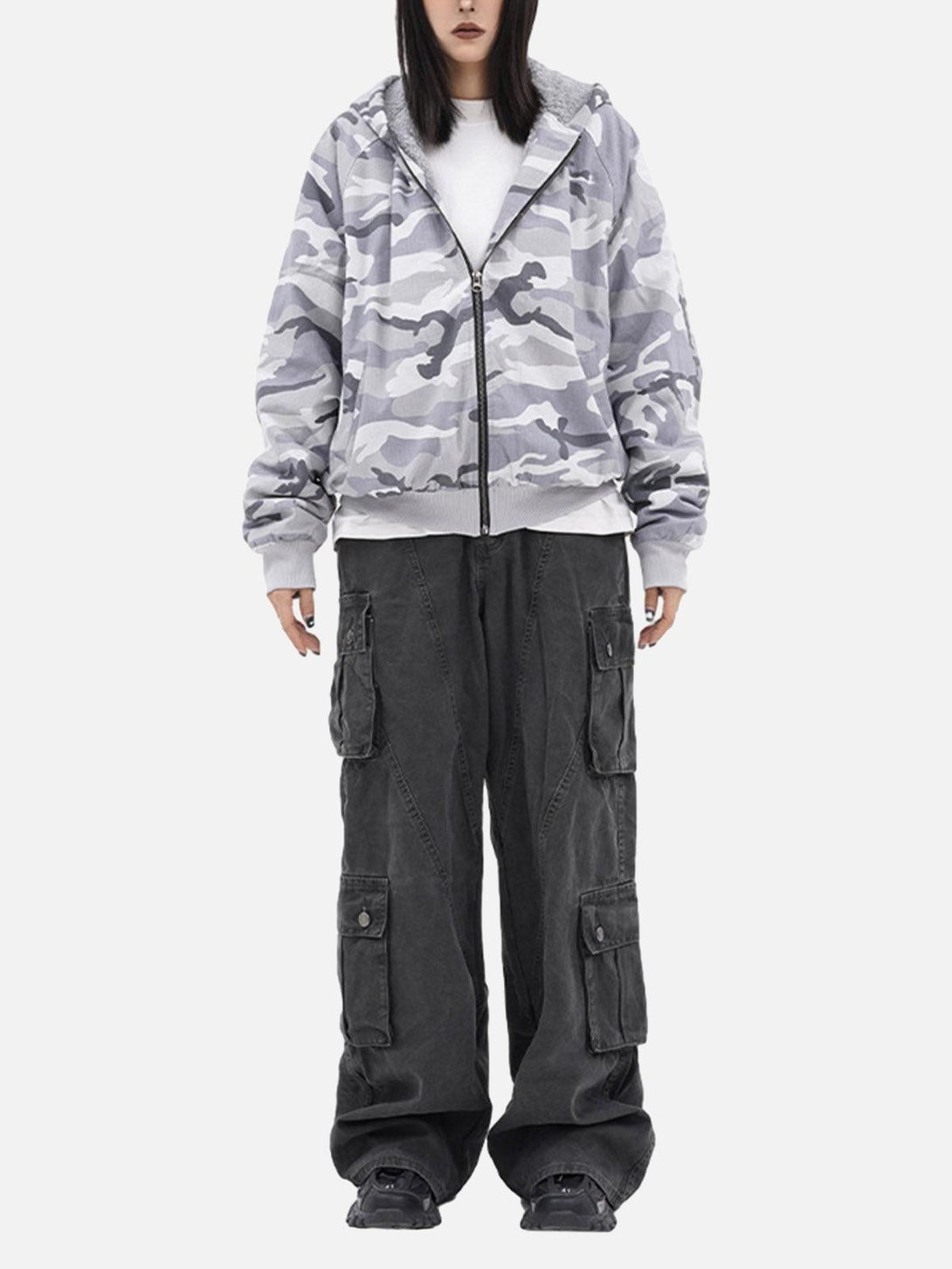 Model wearing a gray camouflage fleece hooded jacket by TALISHKO, paired with cargo pants.