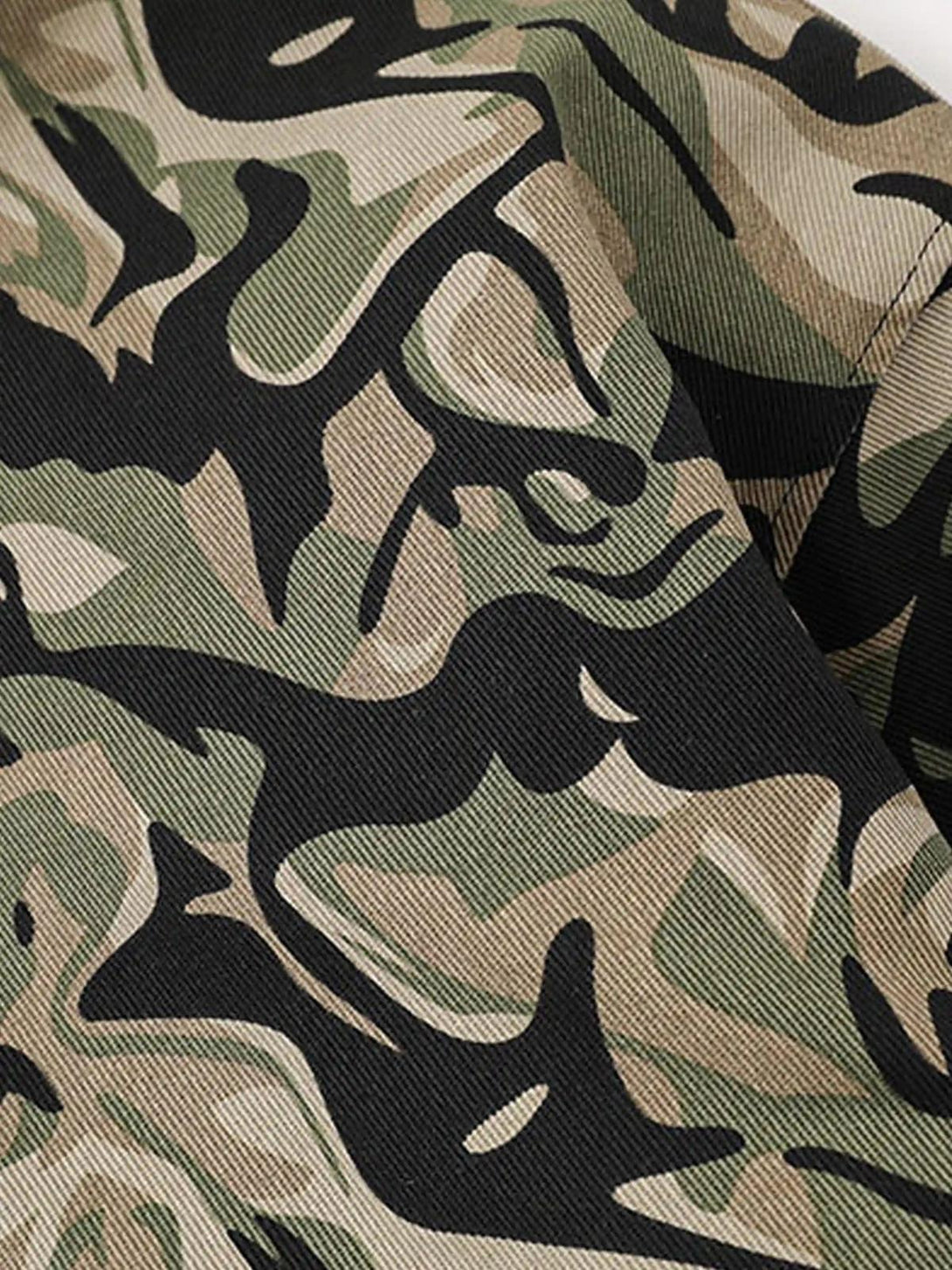 Intricate look at the camouflage pattern of the TALISHKO hoodie, emphasizing its stylish texture.