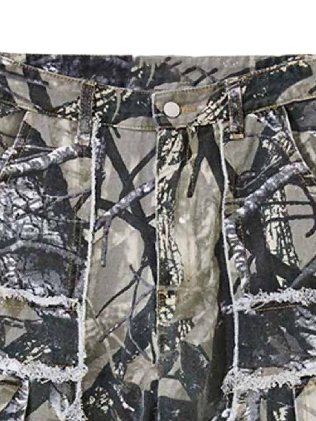 Intricate look at TALISHKO camouflage leaf pants with distressed detailing and unique stitching.