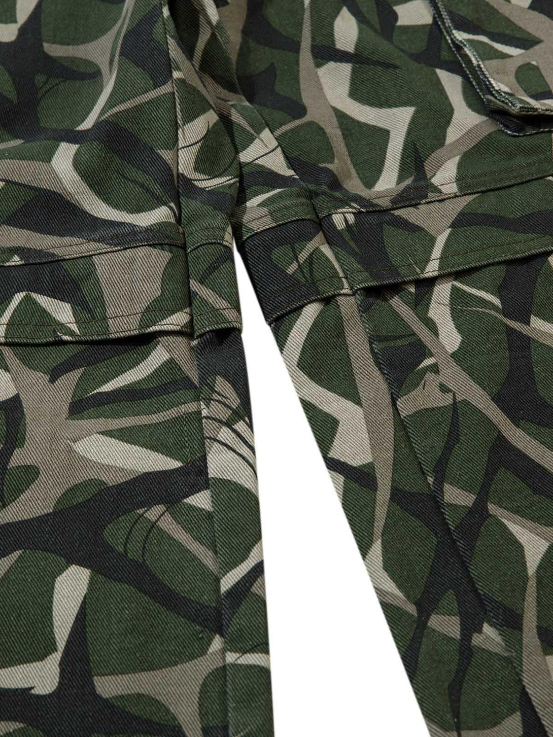 Detailed fabric and stitching on TALISHKO cargo pants with a distinctive camouflage pattern.