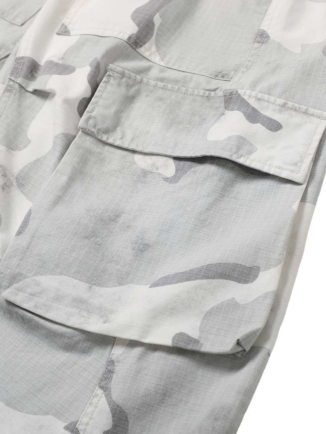 Intricate look at TALISHKO's camouflage cargo shorts, highlighting the multi-pocket detail.
