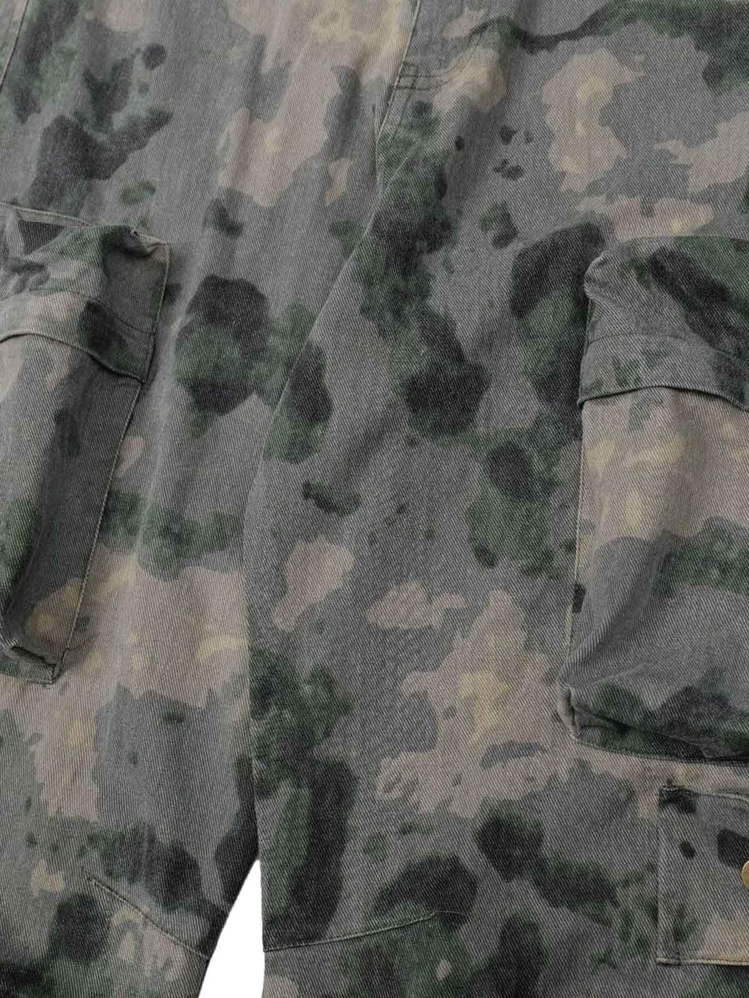 Detailed fabric and stitching on TALISHKO cargo pants, showcasing the camouflage pattern.